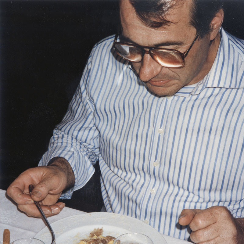 Luciano at the table with one of his favourite dishes